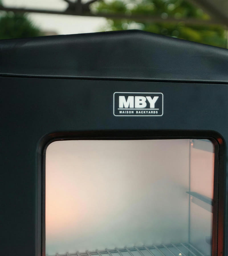 Close-up of an MBY smoker's heavy-gauge steel body and badge