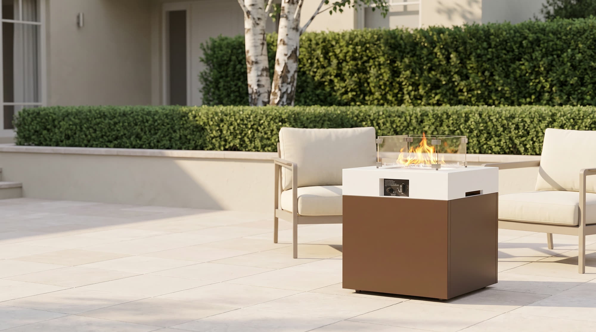 Aluminum fire pit table lit low on a stone patio