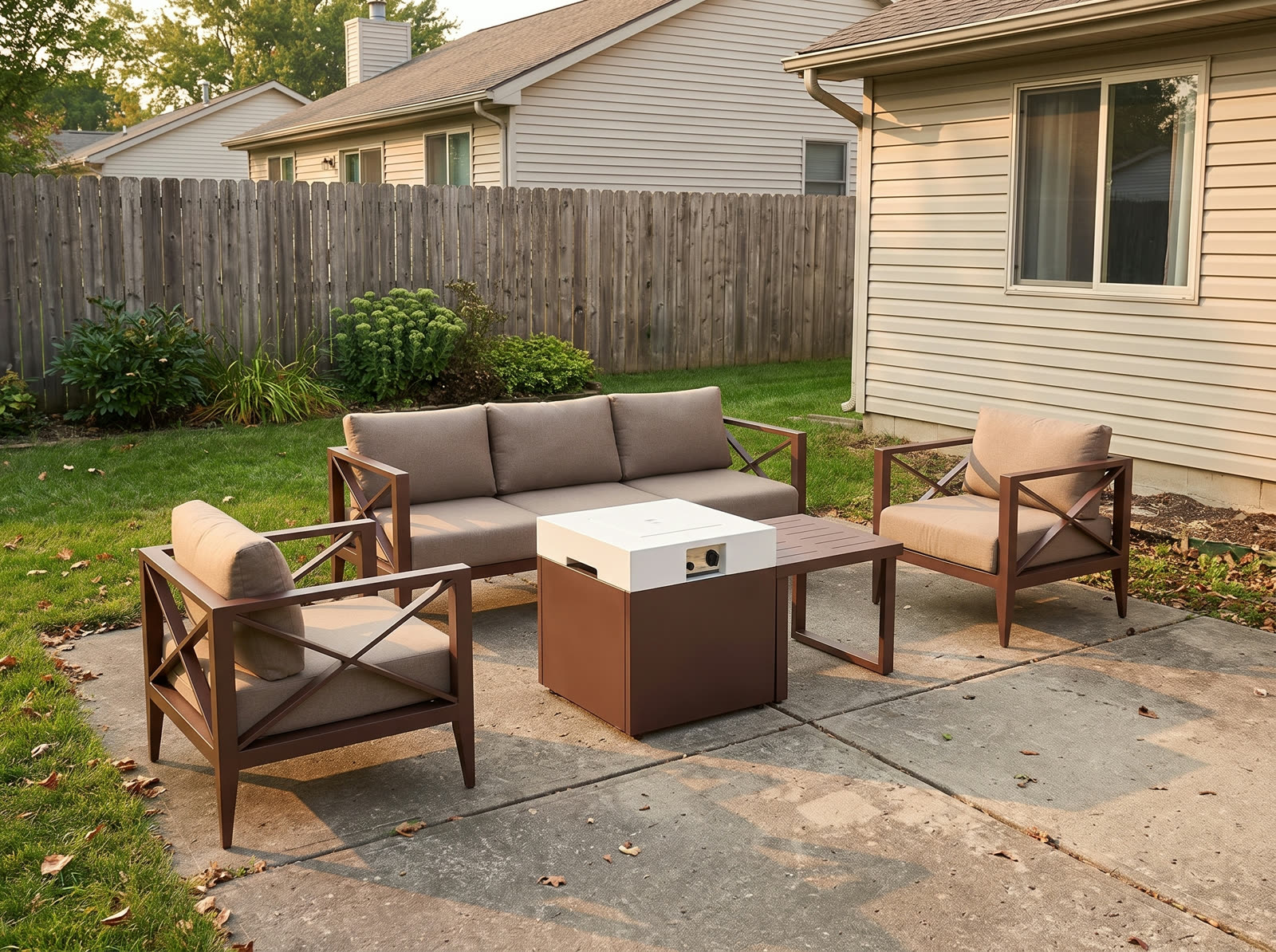 Aluminum conversation set with fire pit table on an ordinary backyard patio